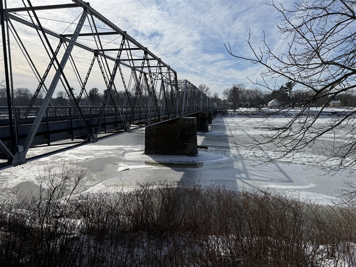 Washington Crossing Bridge in winter over icy Delaware